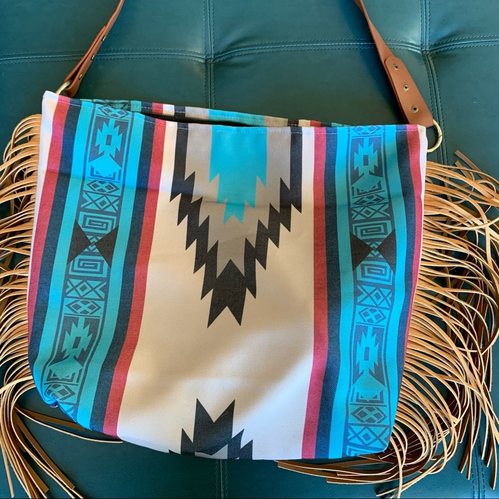 Western style purse with fringe.
